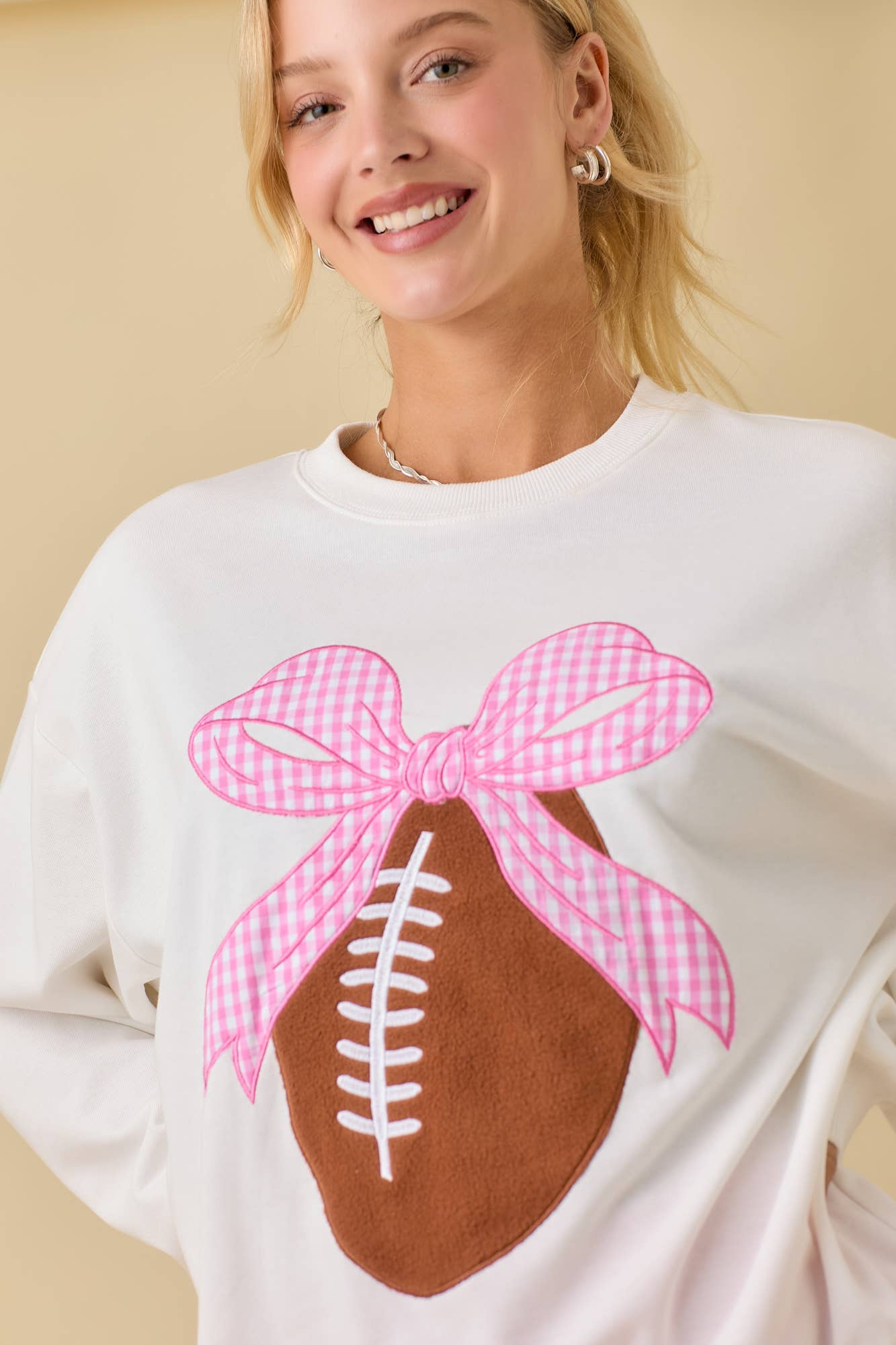 Touchdown & Tied with a Bow Sweatshirt by Main Strip - BFF Here