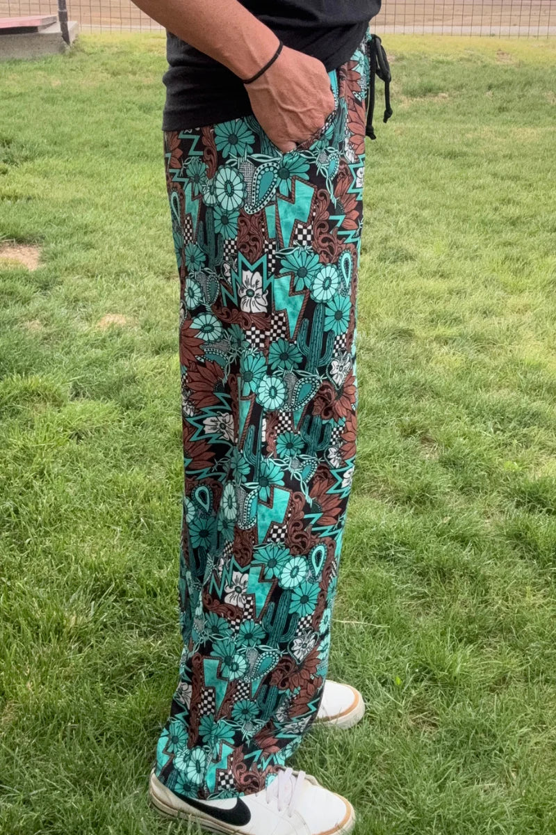 Tattoos In Turquoise Pants by Sterling Kreek - BFF Here